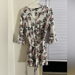 White romper with pink floral imprints